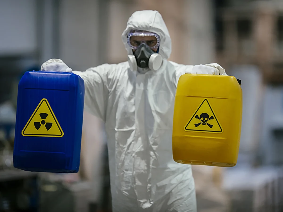 Biohazard cleanup technicians in protective equipment at a remediation scene in Saint Louis, MO